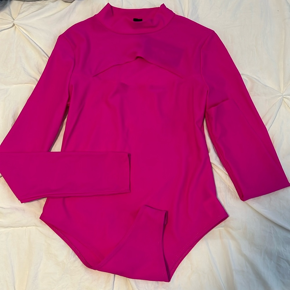 Pink turtle neck body suit.